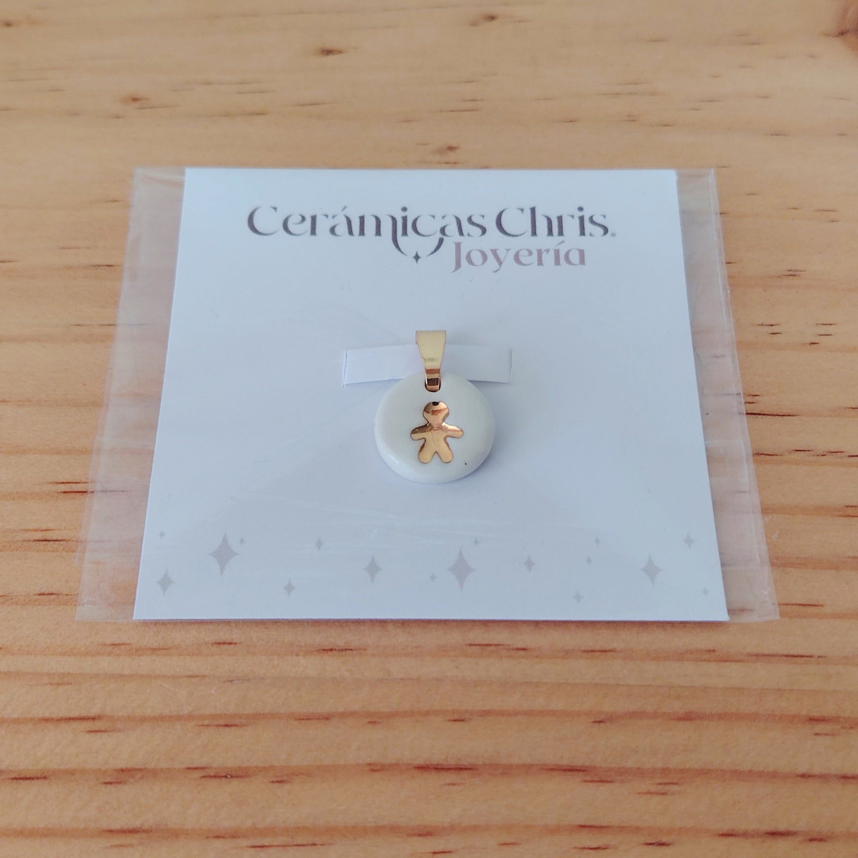Dije Niño de Cerámica con Oro 24k