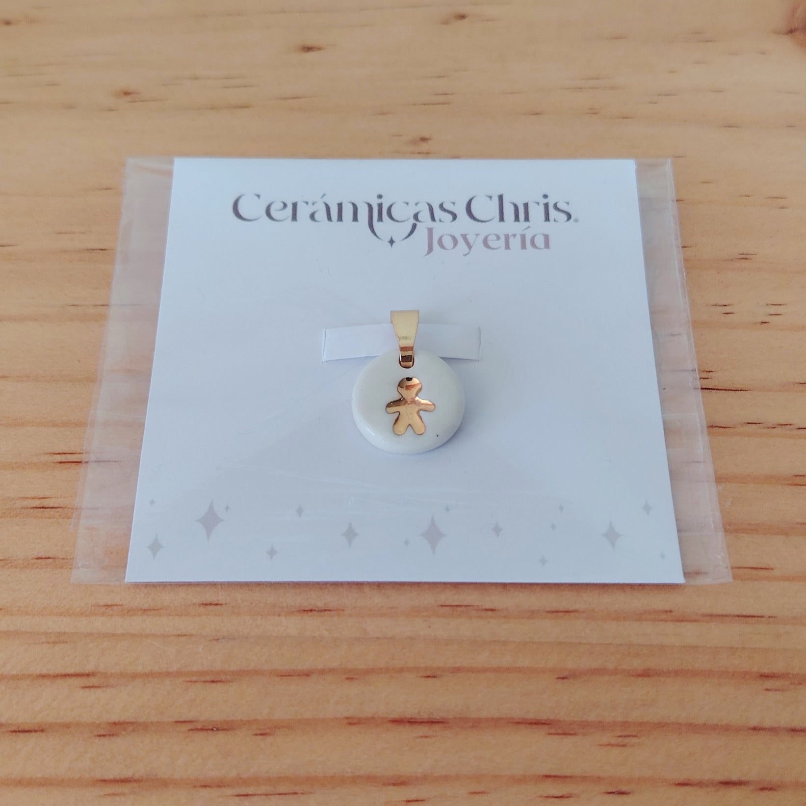 Dije Niño de Cerámica con Oro 24k
